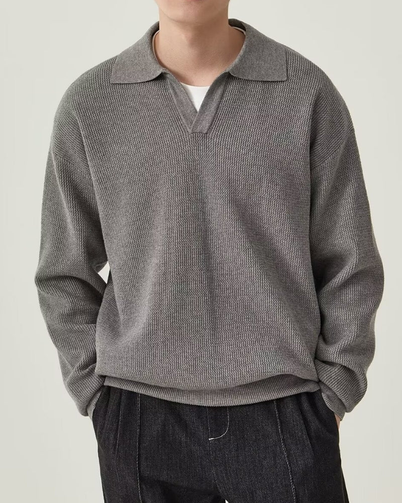 Textured Knit Polo Sweater" can be rewritten as "Knit Polo Sweater with Textured Design.