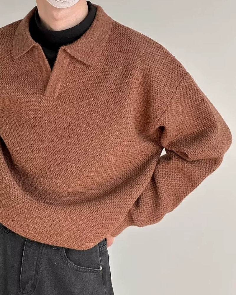 Textured Knit Polo Sweater" can be rewritten as "Knit Polo Sweater with Textured Design.