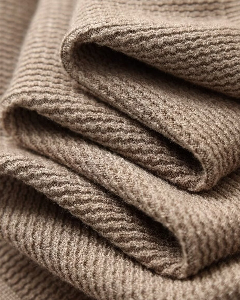 Textured Knit Polo Sweater" can be rewritten as "Knit Polo Sweater with Textured Design.